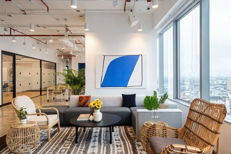 WeWork Spring Tower lounge with plush seating and views across Bangkok