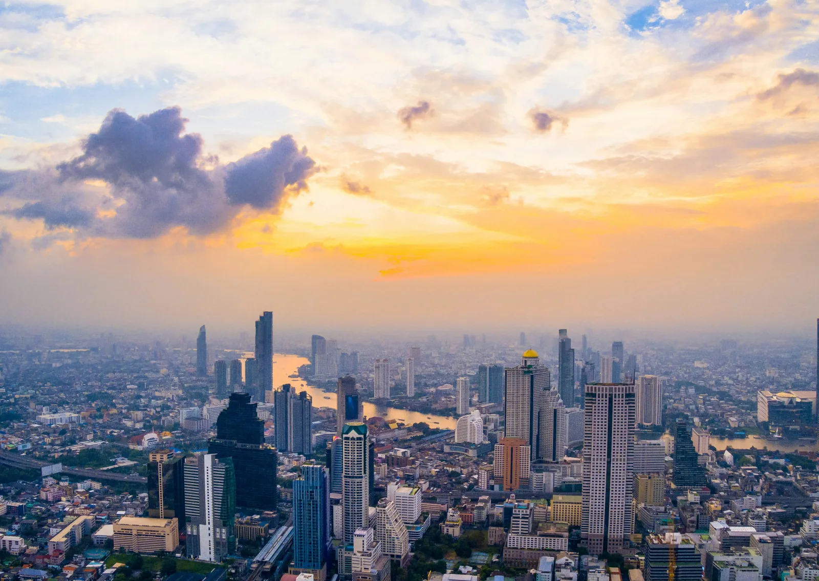 Bangkok cityscape at sunset with the Chao Phraya river